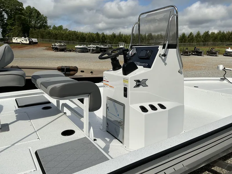 Slide: The Image of 2025 Xpress Hyper-Lift Bay Series 210 BAY-175 HP boat interior with console and seating. - 13
