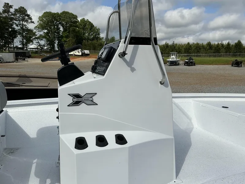 Slide: The Image of 2025 Xpress Hyper-Lift Bay Series 210 BAY-175 HP boat console, featuring steering and controls. - 9