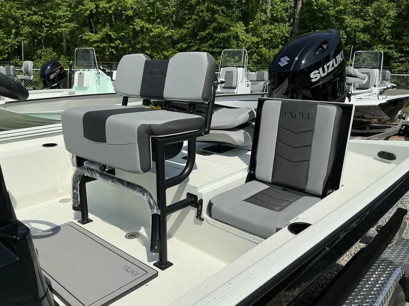 Slide: The Image of 2025 Excel Bay Pro 220 ELITE boat interior with Suzuki engine, featuring comfortable seating. - 3