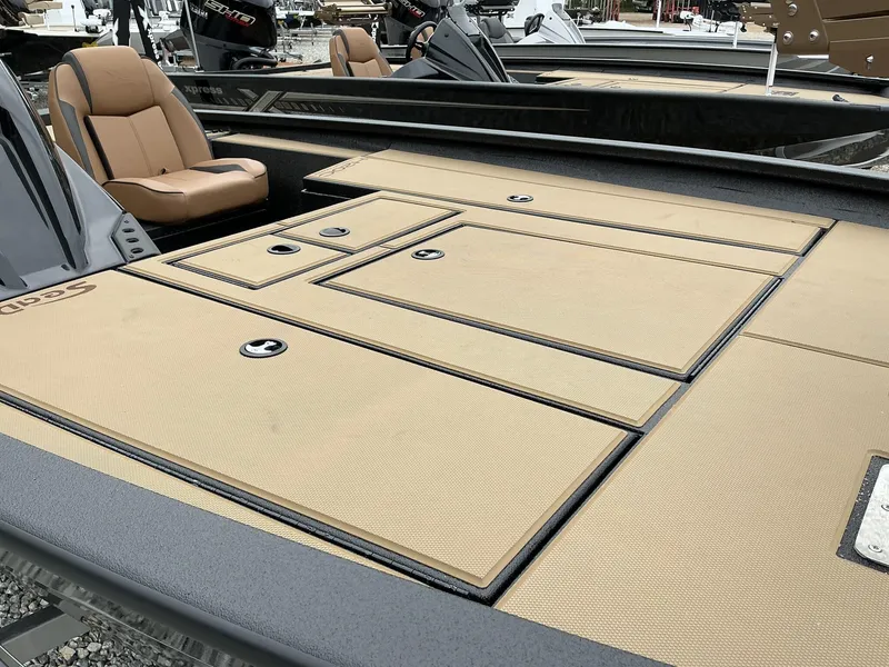 Slide: The Image of 2025 Xpress Hyper-Lift Crappie Series H20 boat with tan deck and seating. - 5