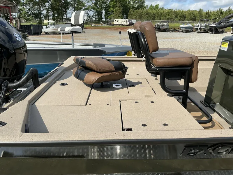 Slide: The Image of 2025 Excel Bay Pro 203 Elite boat with cushioned seating and spacious deck. - 6