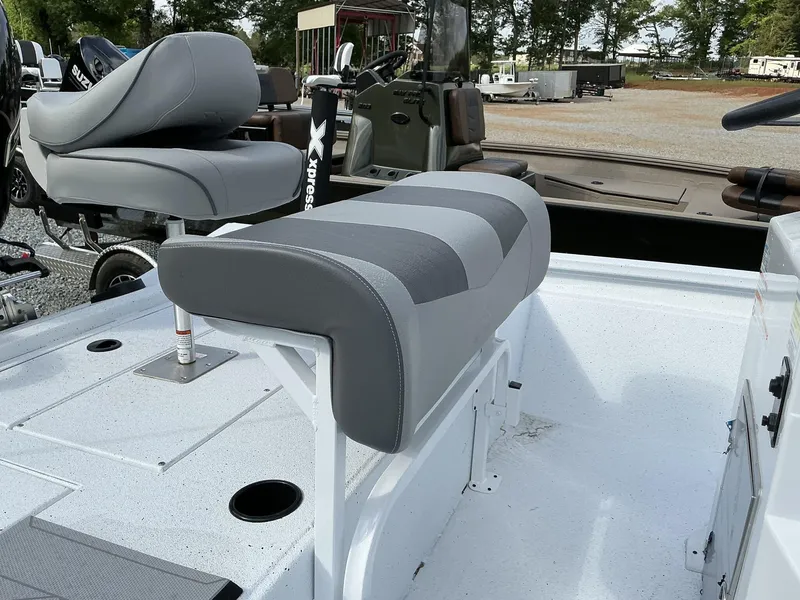 Slide: The Image of 2025 Xpress Hyper-Lift Bay Series 210 BAY-175 HP boat seating area, featuring gray cushioned seats. - 6