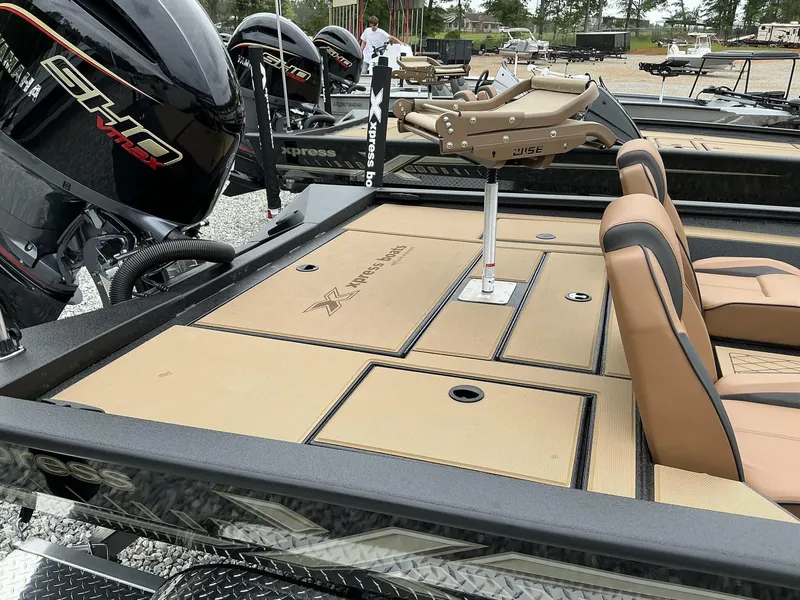 Slide: The Image of 2025 Xpress Hyper-Lift Crappie Series H20 boat with Yamaha engine, featuring tan seating and deck. - 9