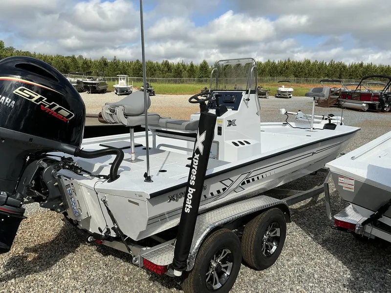 Slide: The Image of 2025 Xpress Hyper-Lift Bay Series 210 BAY-175 HP boat with Yamaha engine on trailer. - 14