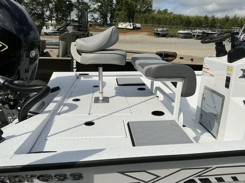 Slide: The Image of 2025 Xpress Hyper-Lift Bay Series 210 BAY-175 HP boat with seating and storage compartments. - 15