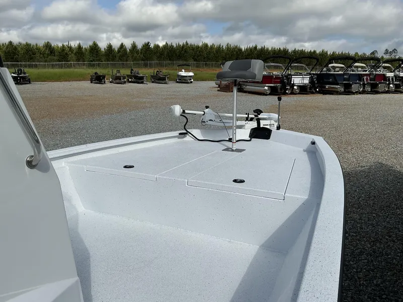 Slide: The Image of 2025 Xpress Hyper-Lift Bay Series 210 BAY-175 HP boat, parked outdoors on gravel. - 8