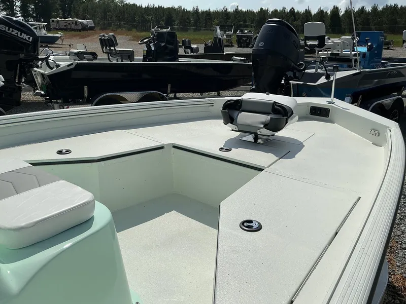 Slide: The Image of 2025 Excel Bay Pro 203 ELITE boat with seating and motor, displayed outdoors. - 3