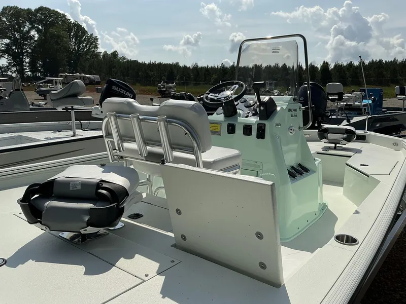 Slide: The Image of 2025 Excel Bay Pro 203 ELITE boat with Suzuki engine, featuring a sleek console and seating. - 6