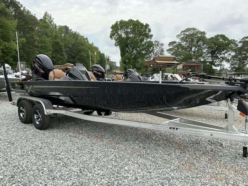 Slide: The Image of 2025 Xpress Hyper-Lift Crappie Series H20 boat on a trailer, parked outdoors. - 1