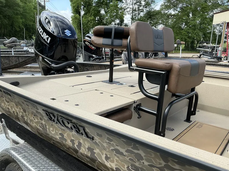 Slide: The Image of 2025 Excel Bay Pro 220 ELITE boat with Suzuki engine, camo design, and comfortable seating. - 5