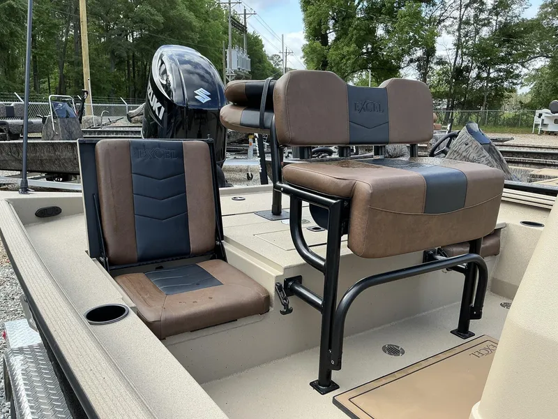 Slide: The Image of 2025 Excel Bay Pro 220 ELITE boat interior with brown and black seating. - 7