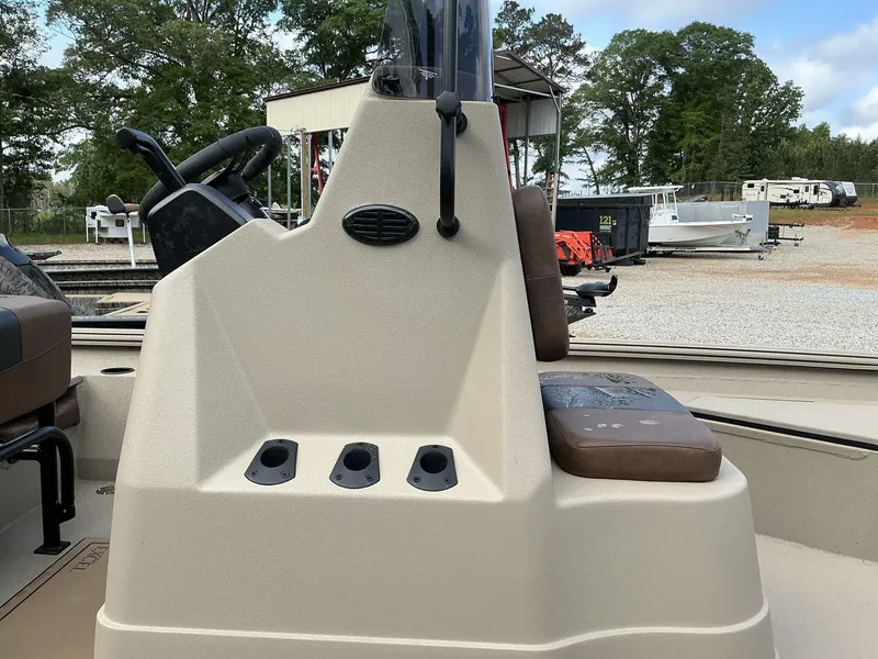 Slide: The Image of 2025 Excel Bay Pro 220 ELITE boat console with steering wheel and seating. - 8