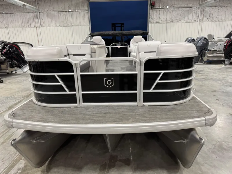 Slide: The Image of 2023 Sweetwater 2286 pontoon boat in a showroom, front view. - 3