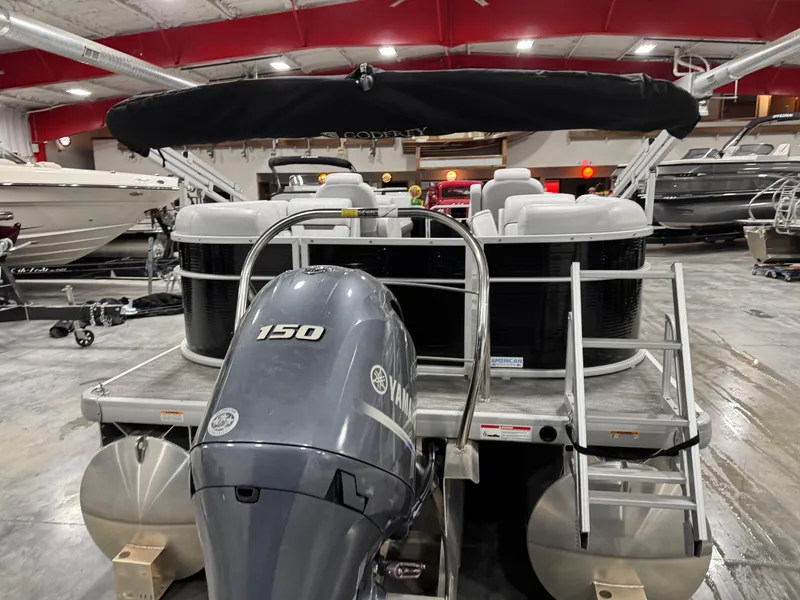 Slide: The Image of 2023 Sweetwater 2286 pontoon boat with Yamaha 150 engine in showroom. - 6