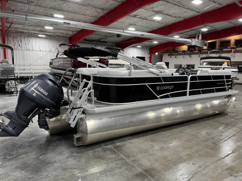 Slide: The Image of 2023 Sweetwater 2286 pontoon boat with Yamaha motor in a showroom. - 7