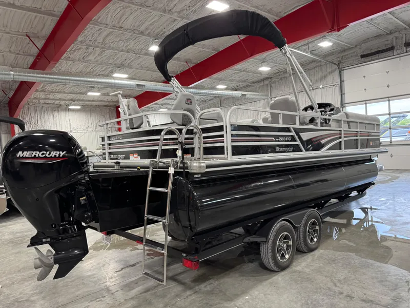 Slide: The Image of 2020 Ranger 223 FC pontoon boat with Mercury engine in a showroom. - 3