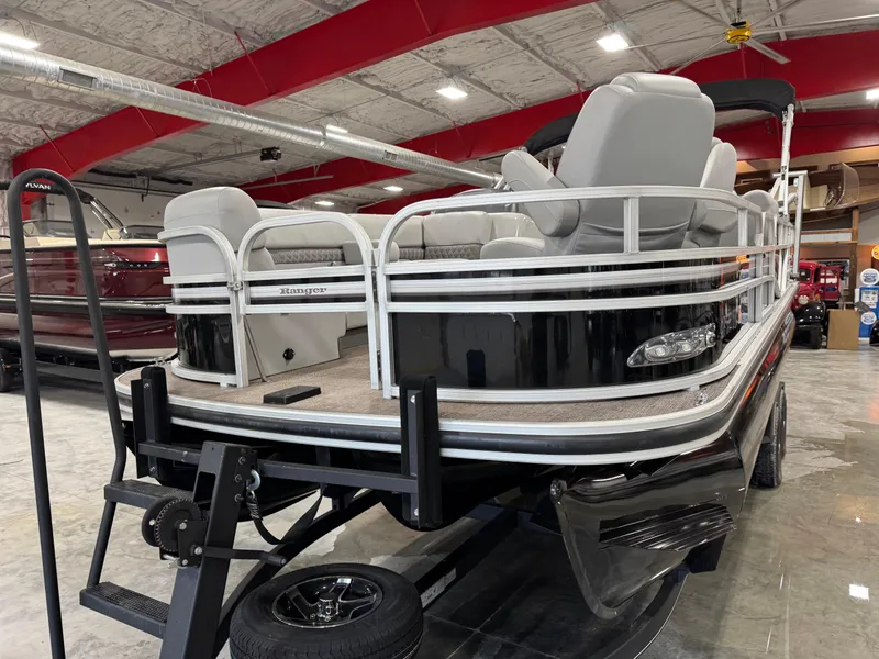 Slide: The Image of 2020 Ranger 223 FC pontoon boat displayed indoors on a trailer. - 5