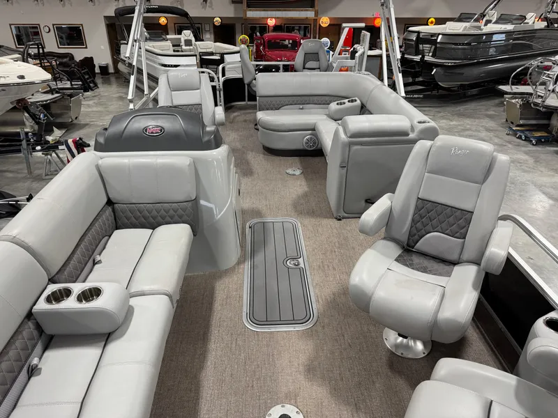 Slide: The Image of 2020 Ranger 223 FC pontoon boat interior with gray seating and spacious layout. - 6