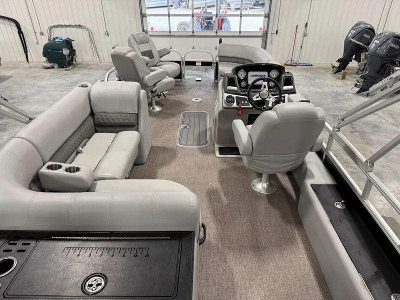 Slide: The Image of 2020 Ranger 223 FC pontoon boat interior with gray seating and modern dashboard. - 8