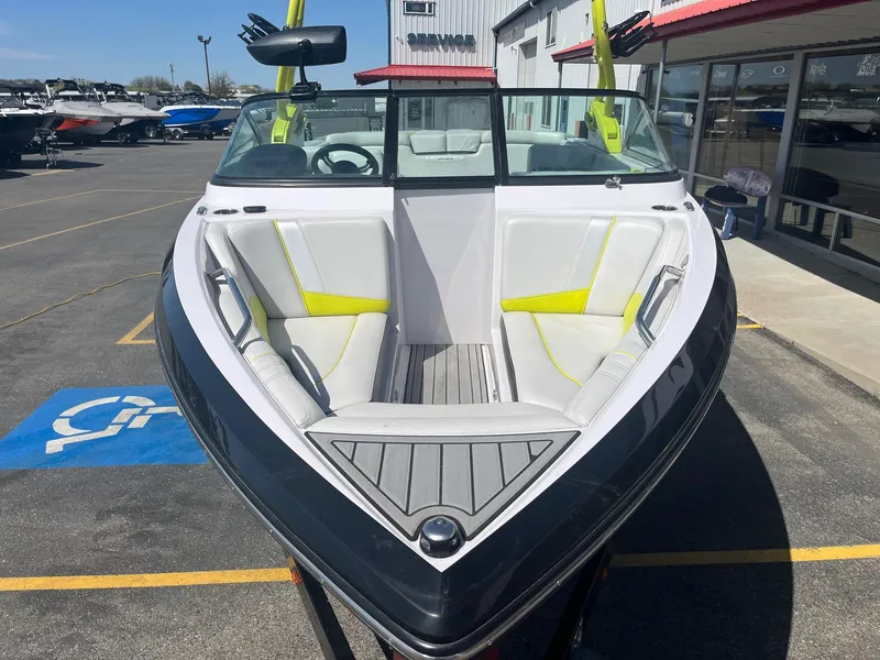 Slide: The Image of 2014 Correct Craft 230 TEAM EDITION boat with sleek design and spacious seating. - 12