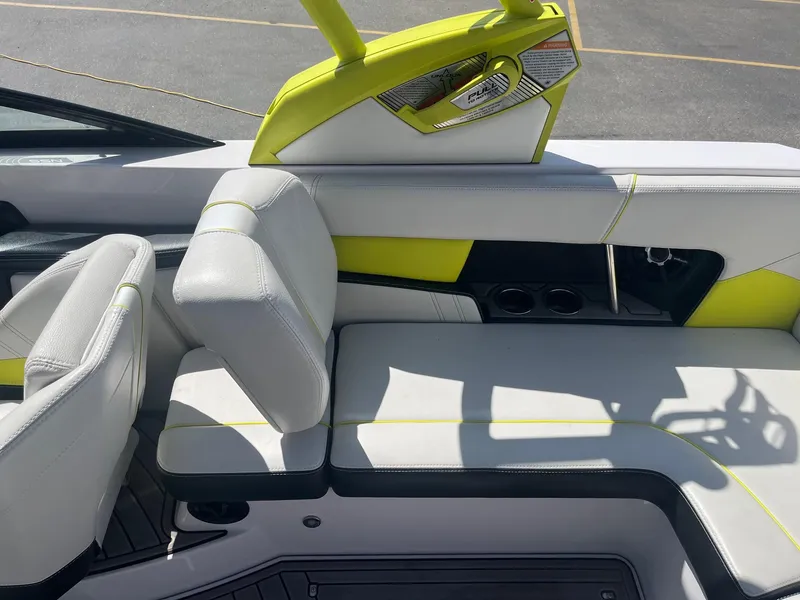 Slide: The Image of 2014 Correct Craft 230 TEAM EDITION boat interior with white and lime green seating. - 19