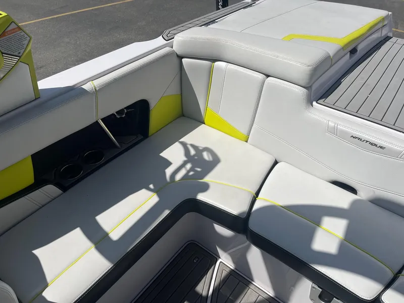 Slide: The Image of 2014 Correct Craft 230 TEAM EDITION boat interior with white and yellow seating. - 20
