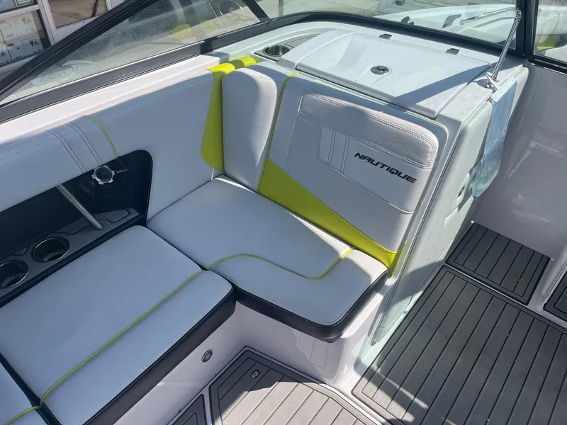 Slide: The Image of 2014 Correct Craft 230 TEAM EDITION boat interior with white and lime green seating. - 24