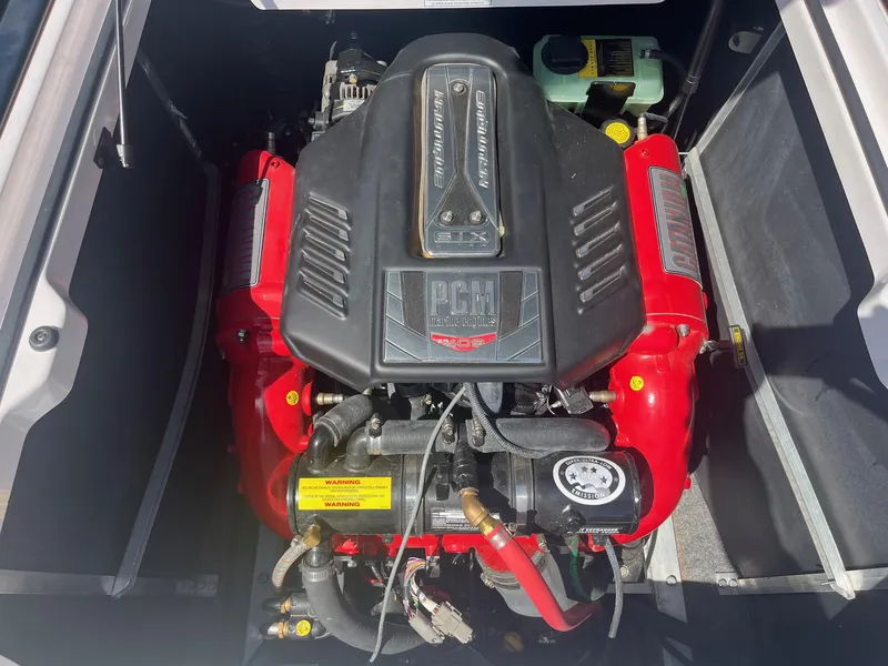 Slide: The Image of 2014 Correct Craft 230 TEAM EDITION engine with PCM 409 horsepower, red and black components. - 35