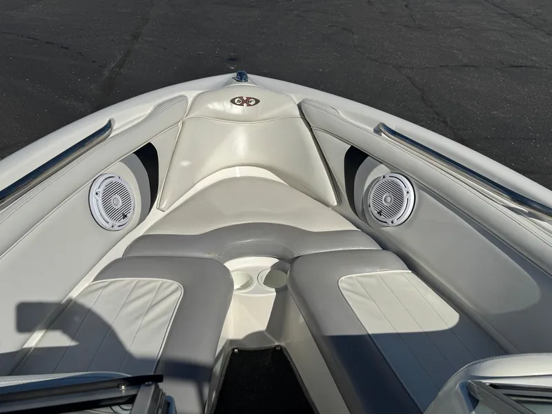 Slide: The Image of 2001 MasterCraft XStar boat interior with white seating and built-in speakers. - 11