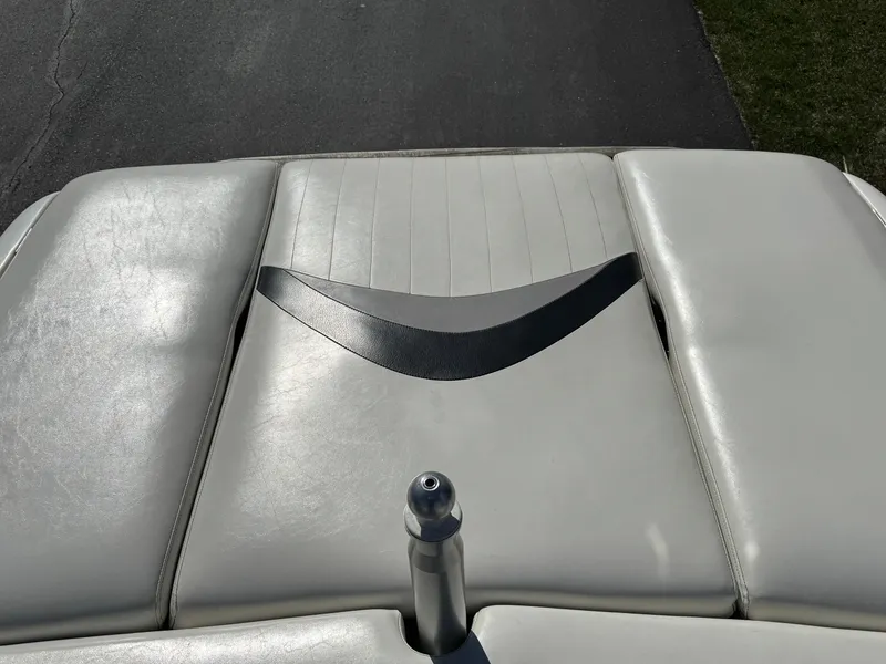 Slide: The Image of 2001 MasterCraft XStar boat seat with sleek white upholstery and black accent. - 13