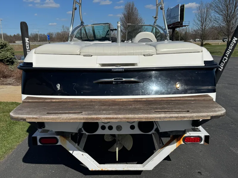 Slide: The Image of 2001 MasterCraft XStar boat rear view with swim platform and wakeboard tower. - 4