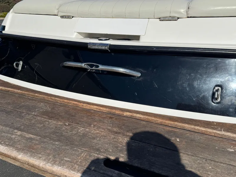 Slide: The Image of 2001 MasterCraft XStar boat stern with wooden platform and cushioned seating. - 5