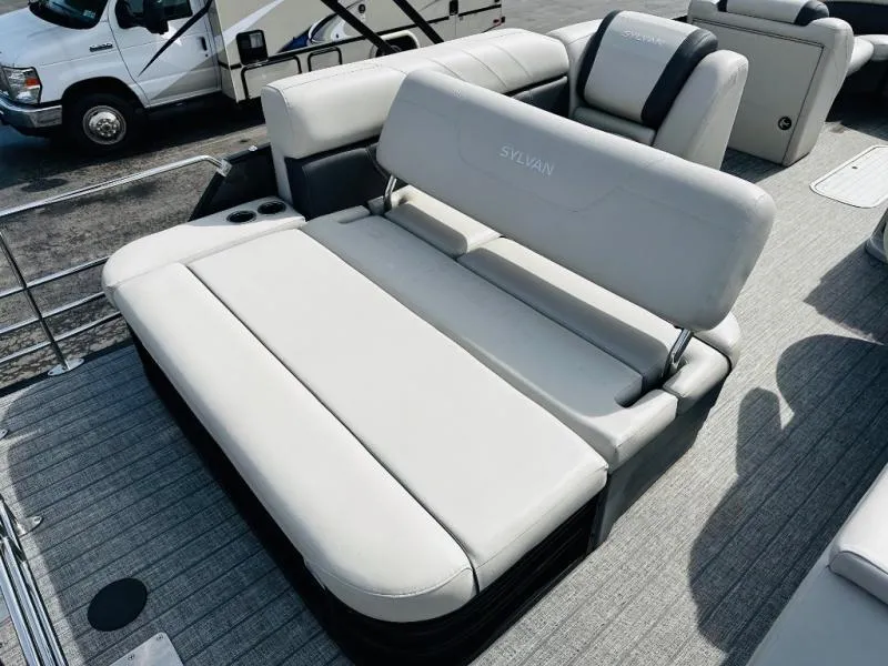 Slide: The Image of Luxurious seating on 2021 L-Series L5 CLZ pontoon boat, featuring plush white upholstery. - 11
