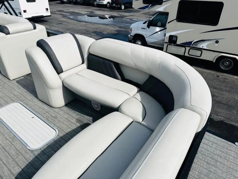 Slide: The Image of Luxurious seating on 2021 L-Series L5 CLZ boat, featuring plush white upholstery. - 7
