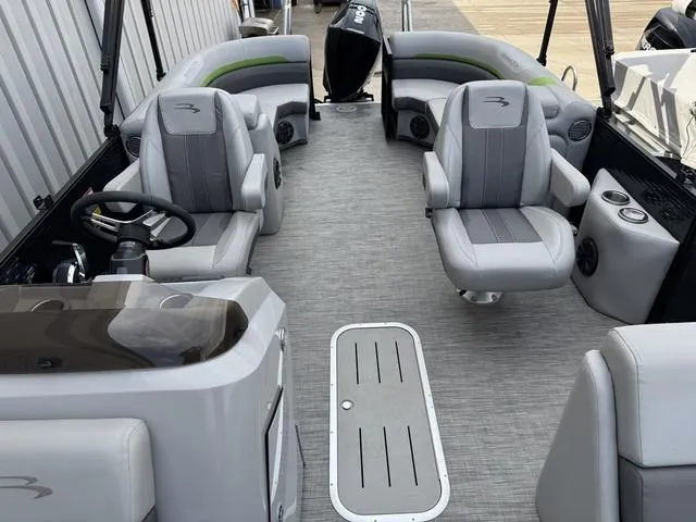 Slide: The Image of 2020 Bennington 22 SSRX pontoon boat interior with gray seating and steering console. - 10