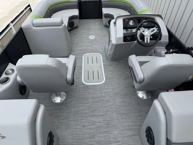 Slide: The Image of Interior of a 2020 Bennington 22 SSRX pontoon boat with gray seating and steering console. - 12