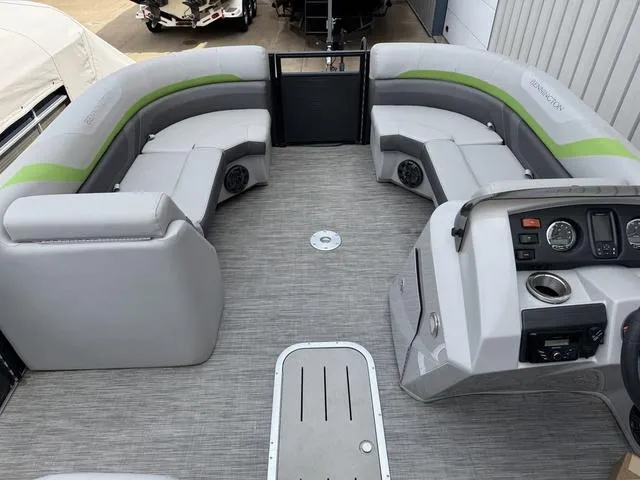 Slide: The Image of 2020 Bennington 22 SSRX pontoon boat interior with gray seating and modern dashboard. - 13