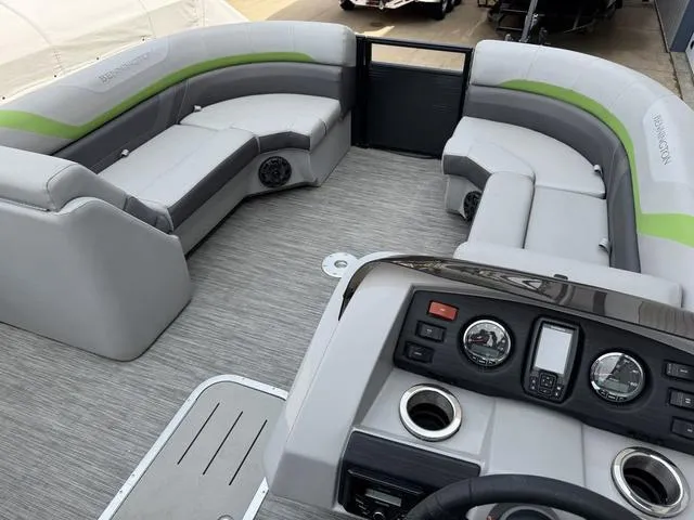 Slide: The Image of 2020 Bennington 22 SSRX pontoon boat interior with gray seating and control panel. - 14