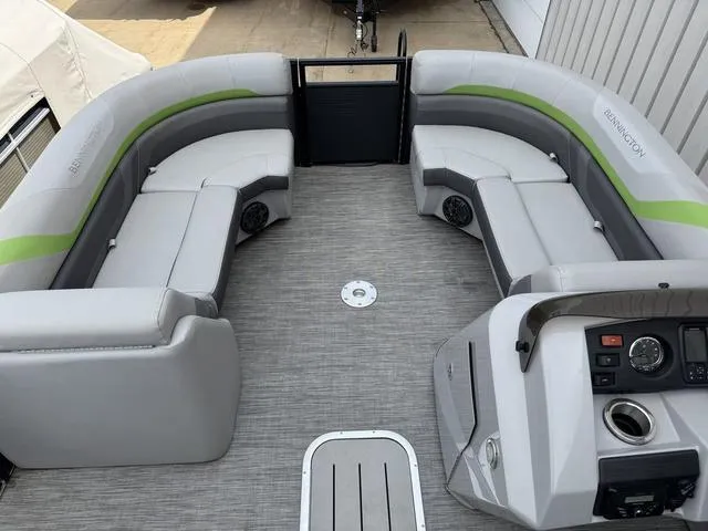 Slide: The Image of 2020 Bennington 22 SSRX pontoon boat interior with gray seating and modern dashboard. - 15
