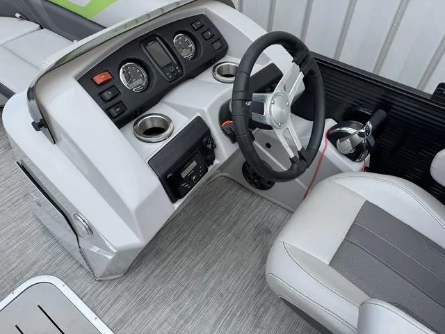 Slide: The Image of 2020 Bennington 22 SSRX boat dashboard with steering wheel and control panel. - 18