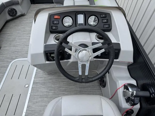 Slide: The Image of 2020 Bennington 22 SSRX boat dashboard with steering wheel and control panel. - 19