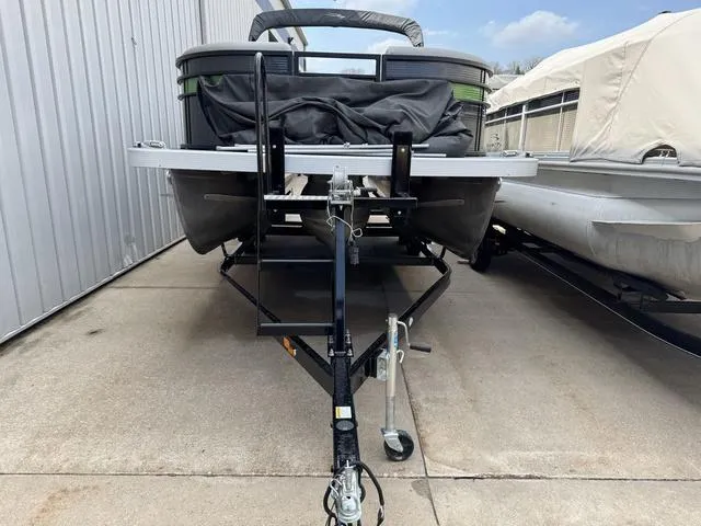 Slide: The Image of 2020 Bennington 22 SSRX pontoon boat on trailer, parked outdoors. - 3