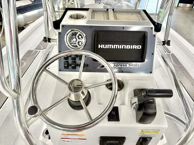 Slide: The Image of 2023 Xpress Boats H22B console with steering wheel and Humminbird electronics. - 3