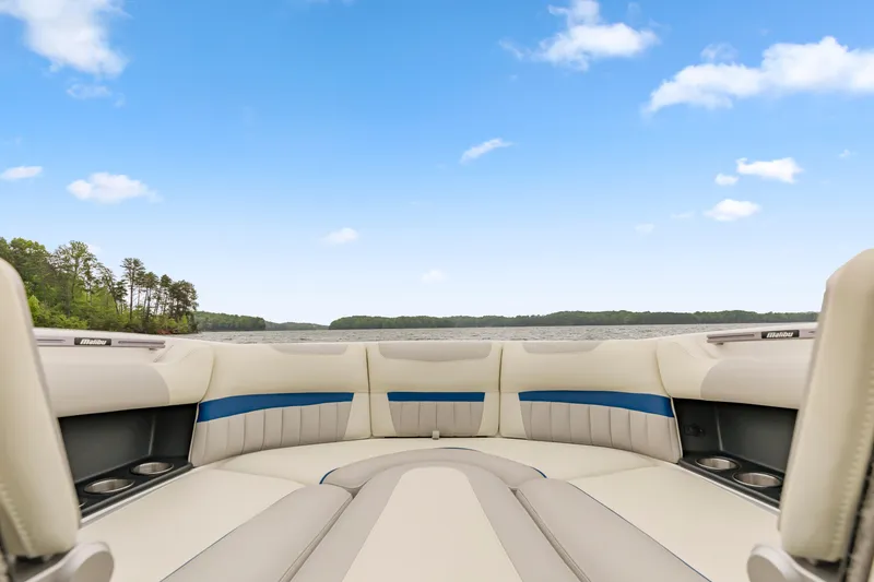 Slide: The Image of 2015 Malibu Wakesetter 24 MXZ interior with lake view and blue sky. - 10