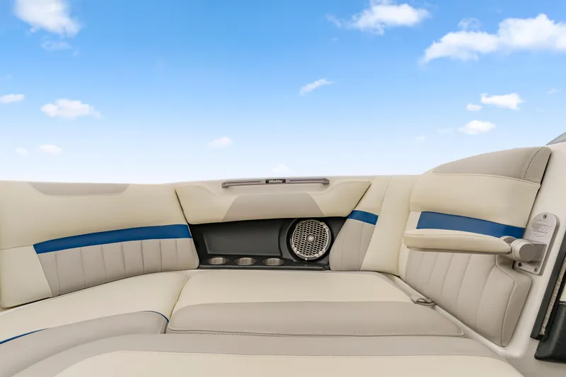 Slide: The Image of Interior of 2015 Malibu Wakesetter 24 MXZ boat with beige and blue seating. - 11