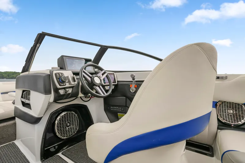 Slide: The Image of 2015 Malibu Wakesetter 24 MXZ boat interior with steering wheel and control panel. - 15