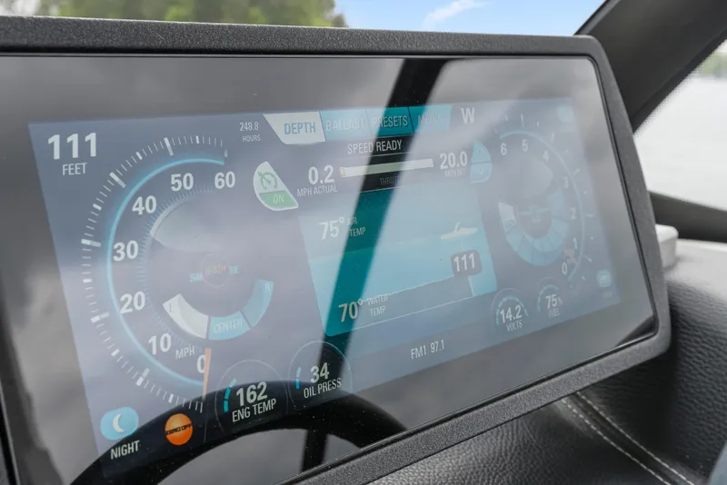 Slide: The Image of Dashboard display of a 2015 Malibu Wakesetter 24 MXZ showing speed, depth, and engine data. - 19