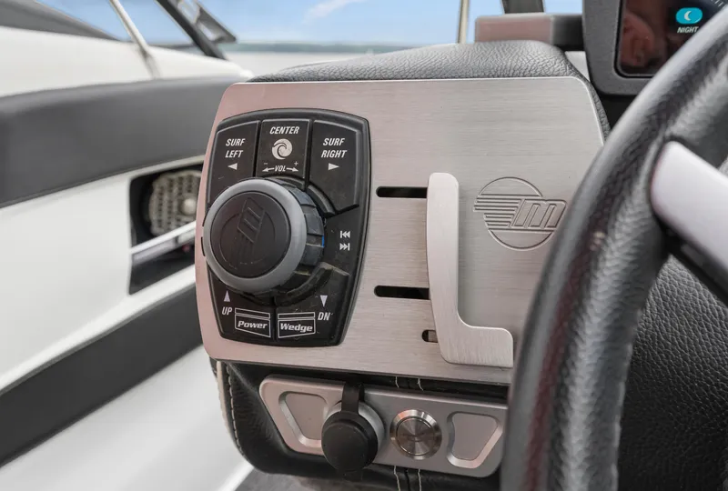 Slide: The Image of Control panel of a 2015 Malibu Wakesetter 24 MXZ boat, featuring surf settings. - 7