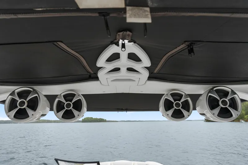 Slide: The Image of 2015 Malibu Wakesetter 24 MXZ boat speakers on a lake. - 8