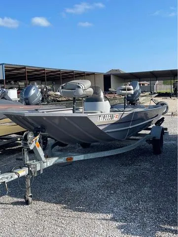 Slide: The Image of 2008 G3 1610 boat on trailer in outdoor storage area. - 2